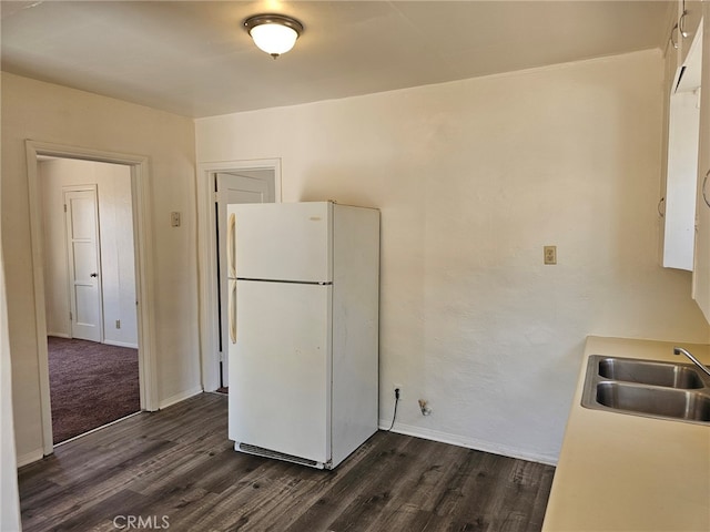 26483 9th St, Highland, CA 92346 - kitchen with freestanding refrigerator, dark wood finished floors, and light countertops