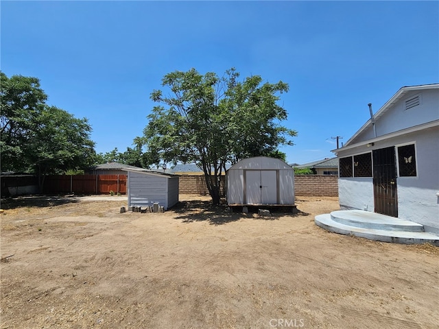 26483 9th St, Highland, CA 92346 - fenced backyard with a shed