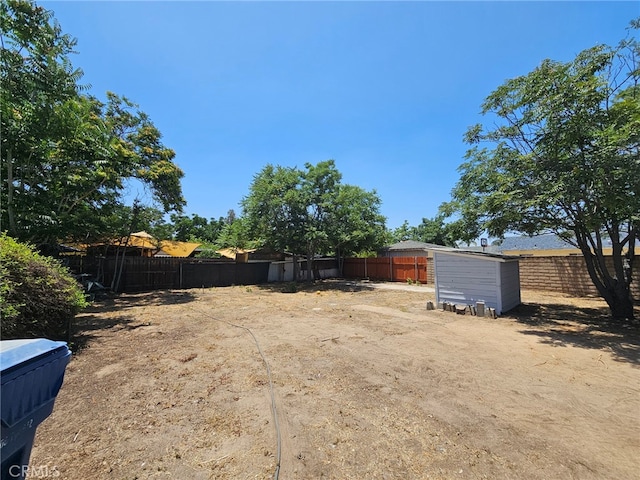 26483 9th St, Highland, CA 92346 - fenced backyard with a shed
