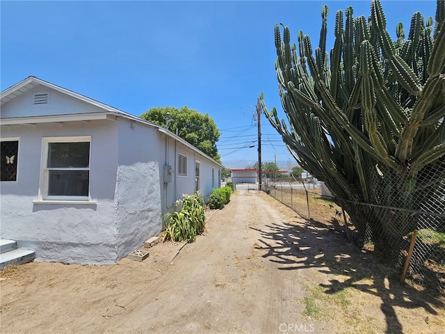 26483 9th St, Highland, CA 92346 - view of home's exterior featuring stucco siding