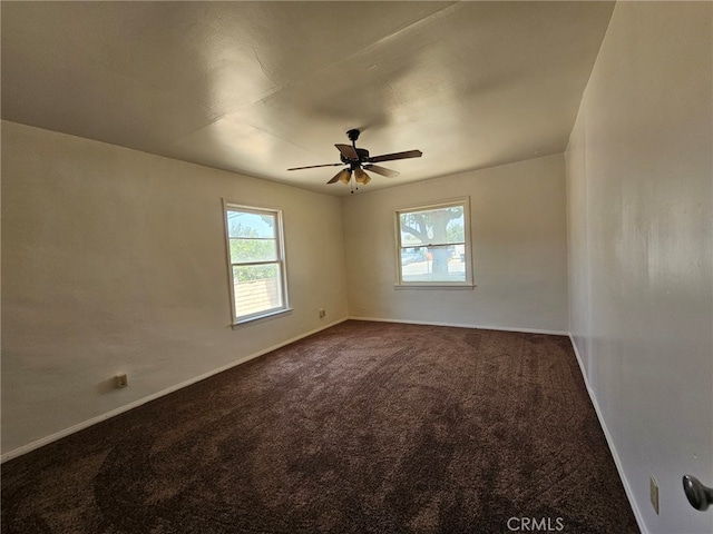 26483 9th St, Highland, CA 92346 - unfurnished room featuring dark carpet and a ceiling fan