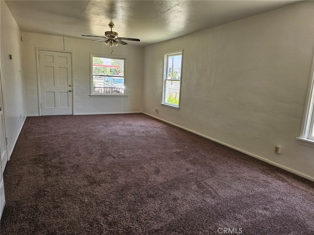 26483 9th St, Highland, CA 92346 - spare room with dark carpet and a ceiling fan
