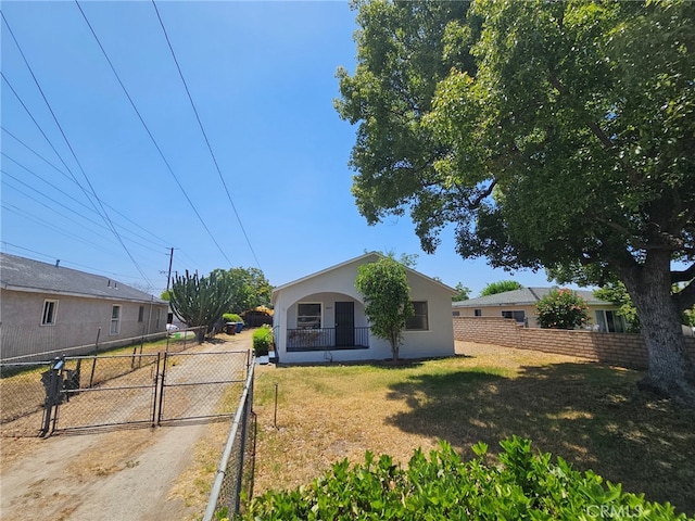 26483 9th St, Highland, CA 92346 - view of front of home with a gate and stucco siding