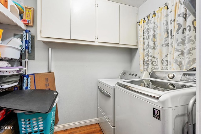 4448 Lubbock Dr Unit C, Simi Valley, CA 93063 - laundry room featuring separate washer and dryer, cabinet space, and wood finished floors