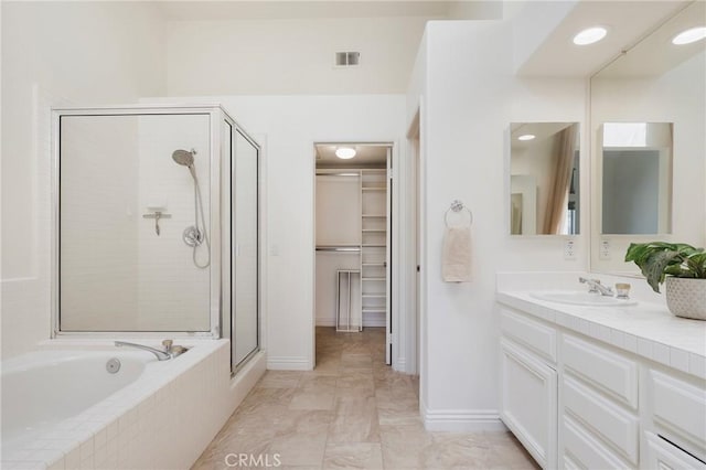 5527 Patricia Way, Yorba Linda, CA 92887 - full bathroom featuring a shower stall, vanity, a garden tub, and a walk in closet