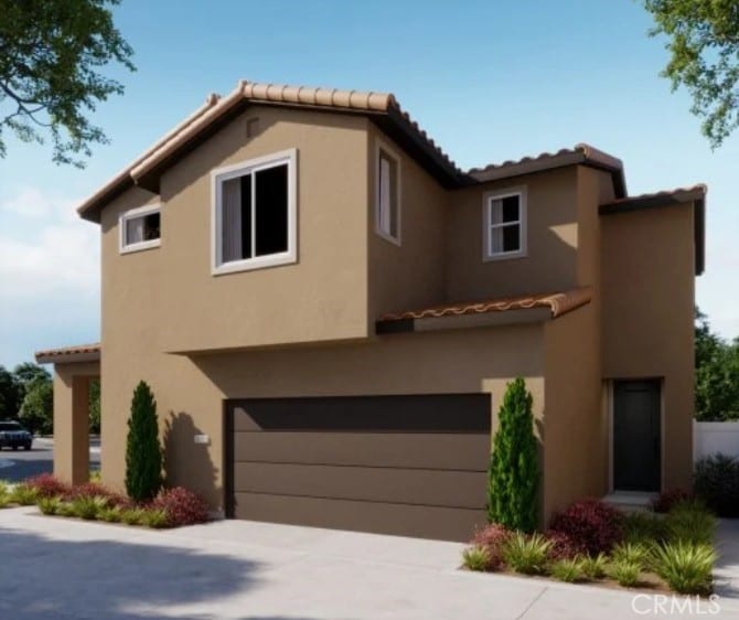 1709 River Vista Way, Lompoc, CA 93436 - view of front of property with an attached garage, a tiled roof, and stucco siding
