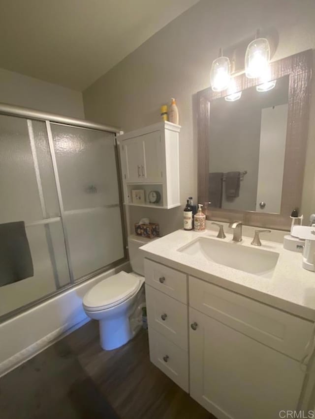 2330 Hosp Way Unit 303, Carlsbad, CA 92008 - bathroom featuring vanity, enclosed tub / shower combo, and wood finished floors