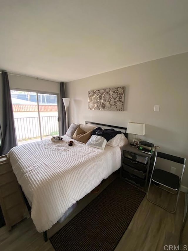 2330 Hosp Way Unit 303, Carlsbad, CA 92008 - bedroom featuring wood finished floors and access to outside