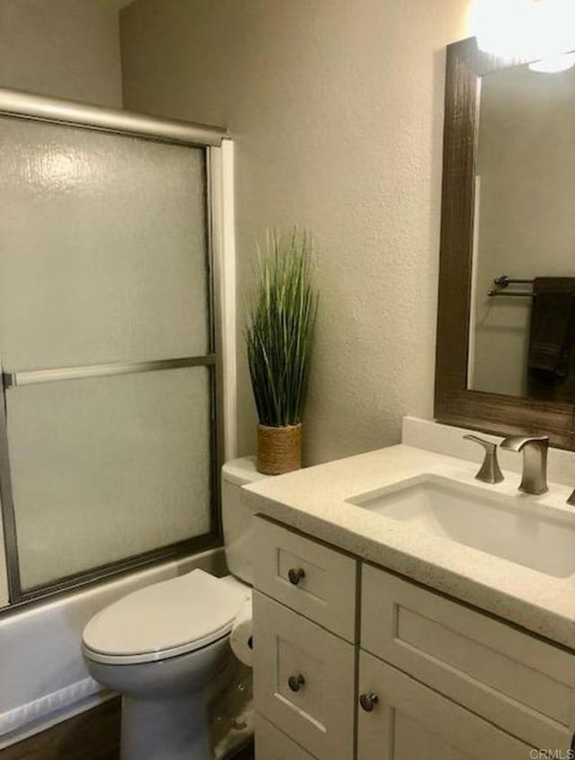2330 Hosp Way Unit 303, Carlsbad, CA 92008 - bathroom with vanity, shower / bath combination with glass door, and a textured wall