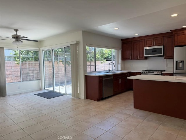 3964 Hibbert Ct, Simi Valley, CA 93063 - kitchen featuring appliances with stainless steel finishes, light countertops, light tile patterned flooring, plenty of natural light, and recessed lighting