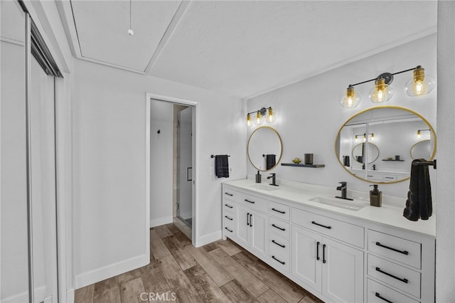 23414 Highcrest Rd, Dana Point, CA 92629 - bathroom with double vanity, wood finished floors, and a stall shower