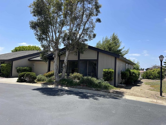 1404 Lombard St, Vista, CA 92084 - view of front of home featuring an attached garage and board and batten siding