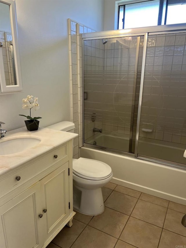 1404 Lombard St, Vista, CA 92084 - bathroom featuring tile patterned floors, vanity, and combined bath / shower with glass door