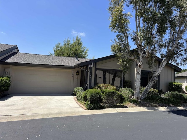 1404 Lombard St, Vista, CA 92084 - view of front facade with a garage, concrete driveway, and a shingled roof