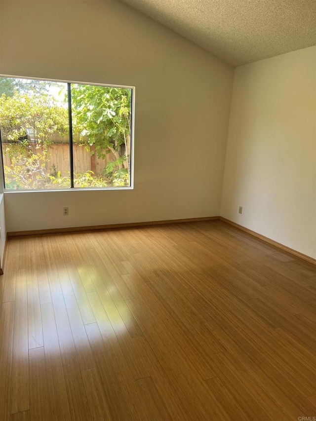 1404 Lombard St, Vista, CA 92084 - empty room featuring wood finished floors and a textured ceiling