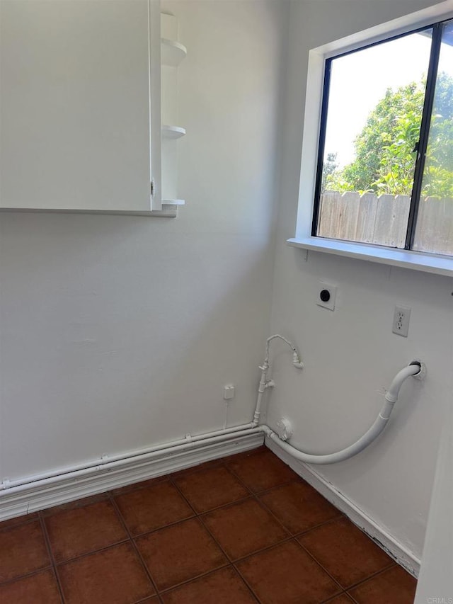 1404 Lombard St, Vista, CA 92084 - laundry room featuring dark tile patterned flooring, electric dryer hookup, and hookup for a gas dryer