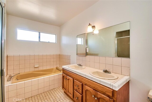 30 N Vega St, Alhambra, CA 91801 - full bathroom with a garden tub, double vanity, decorative backsplash, tile patterned floors, and an enclosed shower