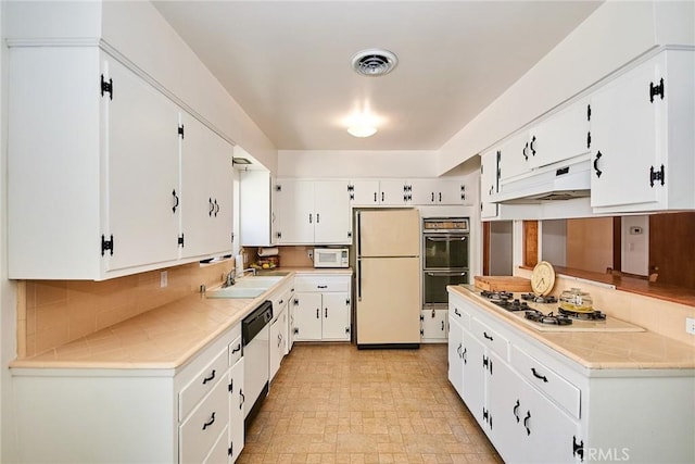 30 N Vega St, Alhambra, CA 91801 - kitchen featuring white appliances, exhaust hood, white cabinetry, and backsplash