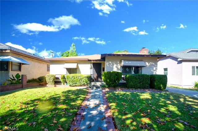 30 N Vega St, Alhambra, CA 91801 - ranch-style house featuring a front lawn, a chimney, and stucco siding