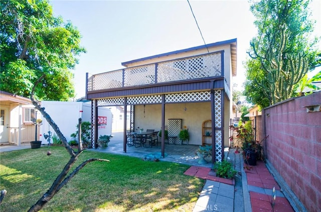 30 N Vega St, Alhambra, CA 91801 - rear view of house featuring a patio, a fenced backyard, and stucco siding