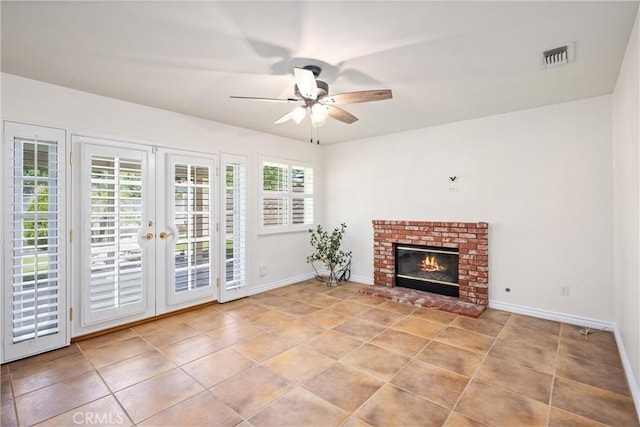 19177 White Dove Ln, Riverside, CA 92508 - unfurnished living room with ceiling fan, french doors, a brick fireplace, and tile patterned floors