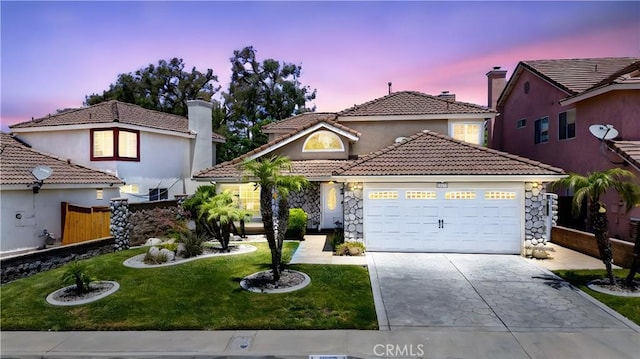 19177 White Dove Ln, Riverside, CA 92508 - mediterranean / spanish-style house with concrete driveway, an attached garage, a tiled roof, a chimney, and stone siding