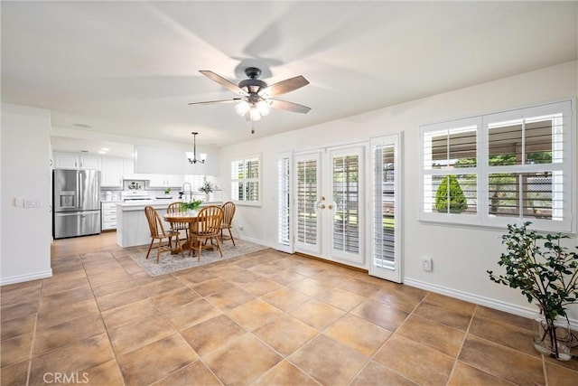 19177 White Dove Ln, Riverside, CA 92508 - dining room featuring ceiling fan, french doors, a chandelier, and light tile patterned floors