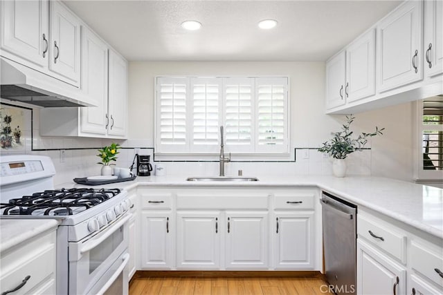 19177 White Dove Ln, Riverside, CA 92508 - kitchen featuring white range with gas stovetop, stainless steel dishwasher, under cabinet range hood, recessed lighting, and light countertops
