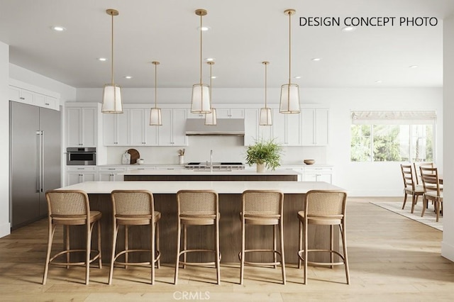 1736 Voorhees Ave, Manhattan Beach, CA 90266 - kitchen featuring stainless steel appliances, white cabinetry, a large island, decorative light fixtures, and recessed lighting