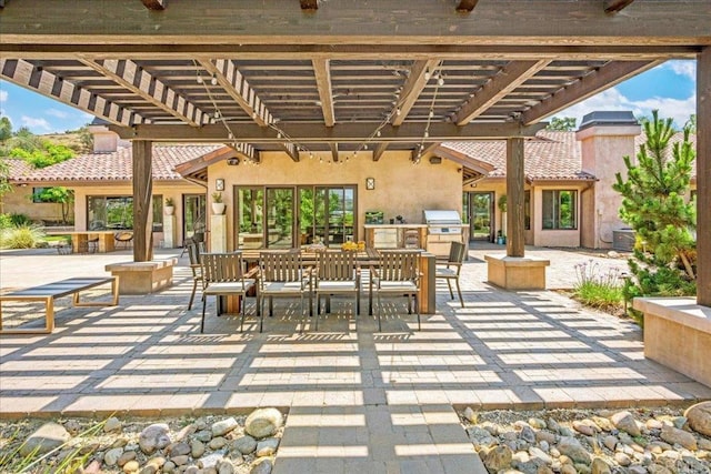 1935 Granite Hills Dr, El Cajon, CA 92019 - view of patio / terrace featuring exterior kitchen, a pergola, and outdoor dining space