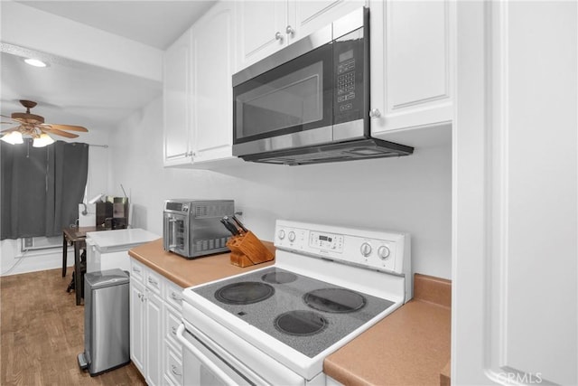382 S Miraleste Dr Unit 450, San Pedro, CA 90732 - kitchen featuring white electric stove, stainless steel microwave, white cabinets, and recessed lighting