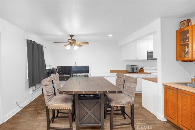 382 S Miraleste Dr Unit 450, San Pedro, CA 90732 - dining space with a ceiling fan, dark wood finished floors, and recessed lighting