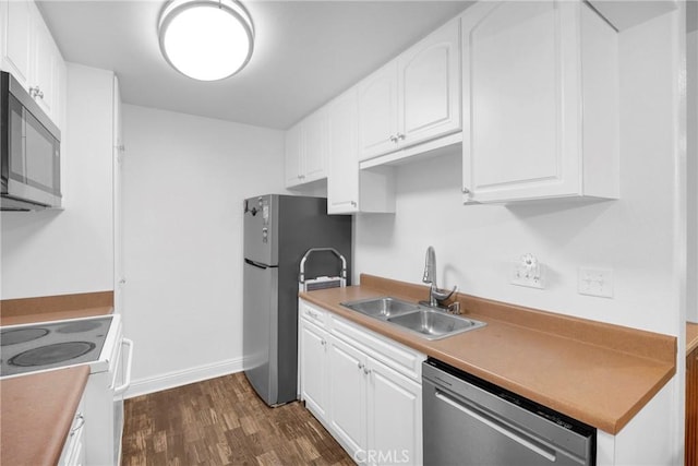 382 S Miraleste Dr Unit 450, San Pedro, CA 90732 - kitchen featuring appliances with stainless steel finishes, dark wood finished floors, white cabinets, and light countertops