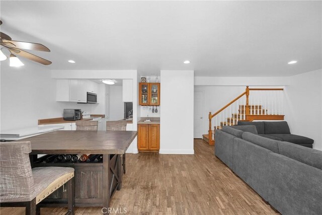 382 S Miraleste Dr Unit 450, San Pedro, CA 90732 - dining area featuring stairway, ceiling fan, wood finished floors, and recessed lighting
