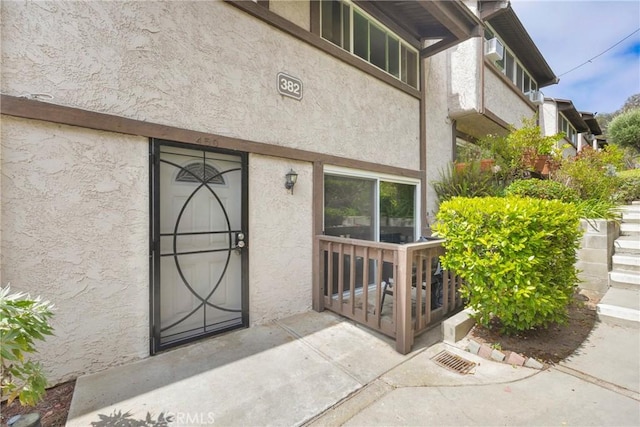 382 S Miraleste Dr Unit 450, San Pedro, CA 90732 - doorway to property featuring stucco siding