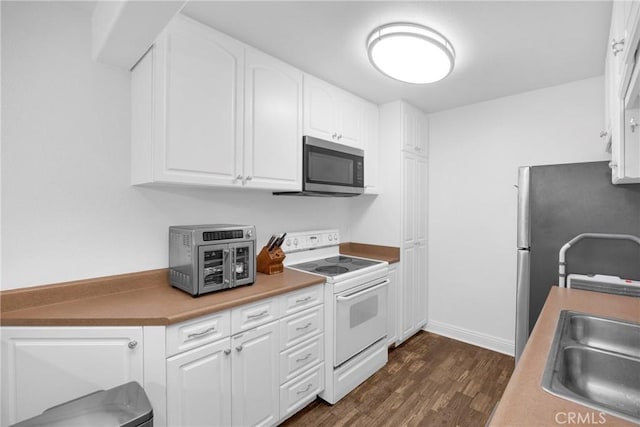 382 S Miraleste Dr Unit 450, San Pedro, CA 90732 - kitchen featuring appliances with stainless steel finishes, dark wood-style flooring, and white cabinets