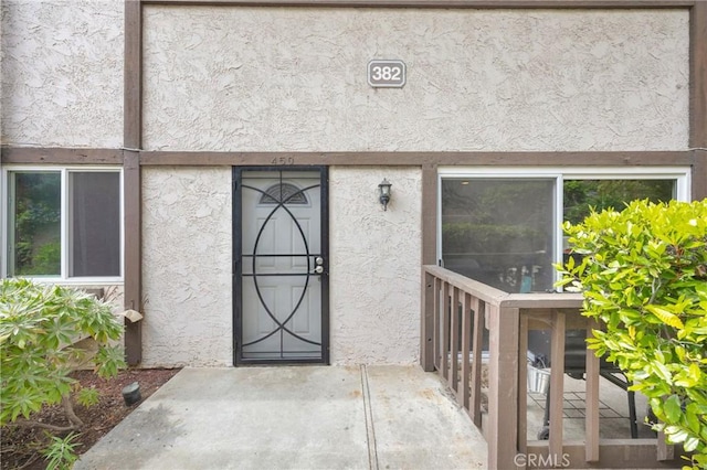 382 S Miraleste Dr Unit 450, San Pedro, CA 90732 - doorway to property featuring stucco siding