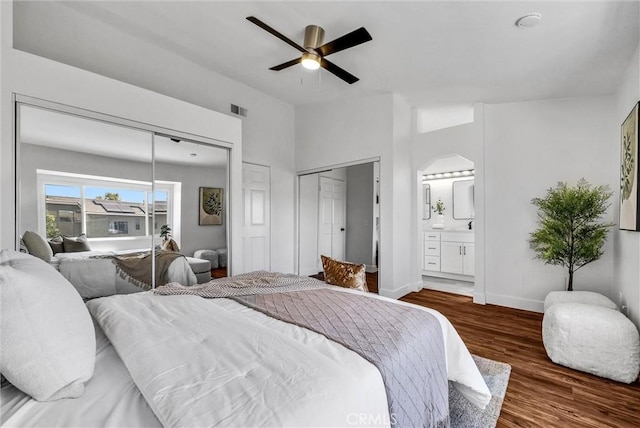 1251 Mayfair Dr, Corona, CA 92882 - bedroom with wood finished floors, a ceiling fan, connected bathroom, and two closets