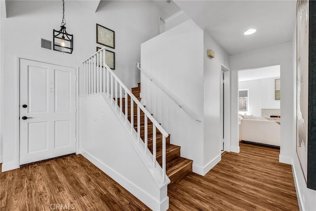 1251 Mayfair Dr, Corona, CA 92882 - stairs with wood finished floors and recessed lighting