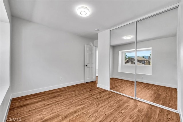 1251 Mayfair Dr, Corona, CA 92882 - unfurnished bedroom featuring wood finished floors and a closet