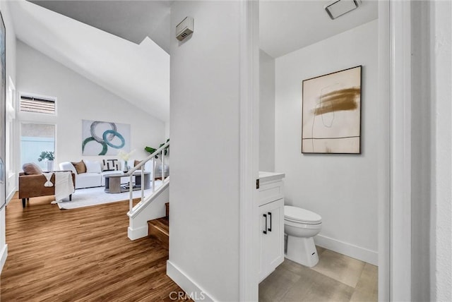 1251 Mayfair Dr, Corona, CA 92882 - bathroom featuring vanity, lofted ceiling, and wood finished floors