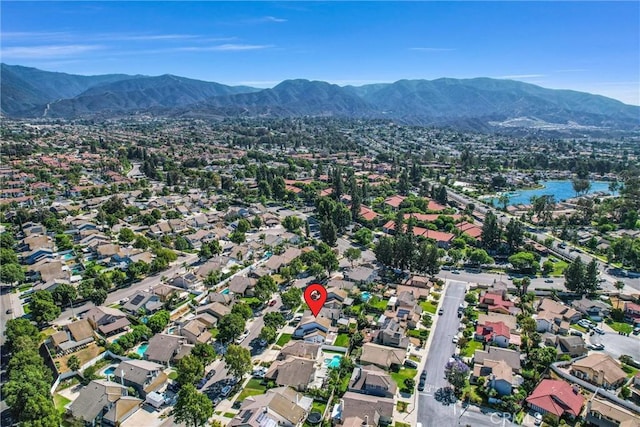 1251 Mayfair Dr, Corona, CA 92882 - aerial overview of property's location with a mountain backdrop and nearby suburban area