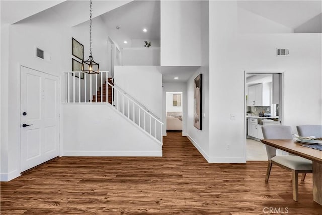 1251 Mayfair Dr, Corona, CA 92882 - entryway with high vaulted ceiling, wood finished floors, stairs, and recessed lighting