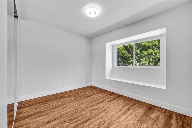 1251 Mayfair Dr, Corona, CA 92882 - spare room with baseboards and wood finished floors
