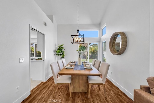1251 Mayfair Dr, Corona, CA 92882 - dining room featuring a chandelier and wood finished floors