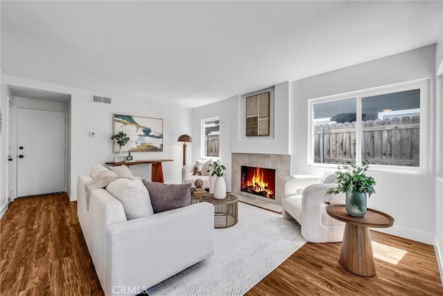 1251 Mayfair Dr, Corona, CA 92882 - living area featuring a fireplace with flush hearth and wood finished floors
