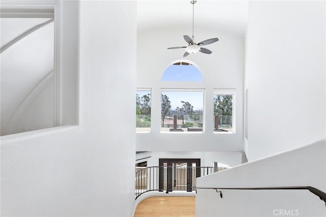 22870 Trigger St, Chatsworth, CA 91311 - stairway featuring a ceiling fan, high vaulted ceiling, and wood finished floors