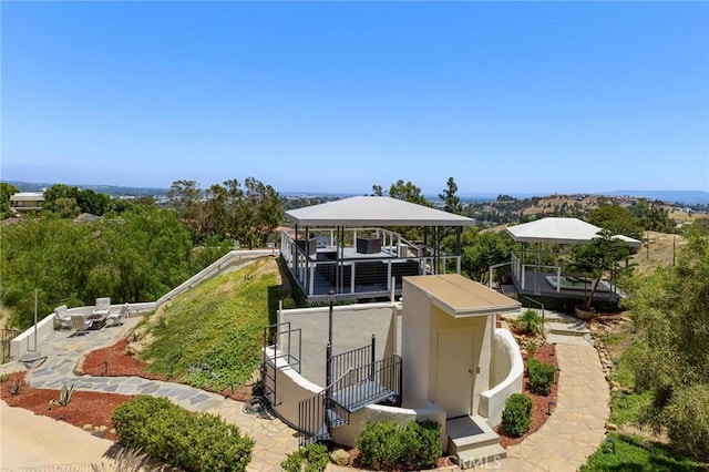 22870 Trigger St, Chatsworth, CA 91311 - view of home's exterior featuring stucco siding and a patio area