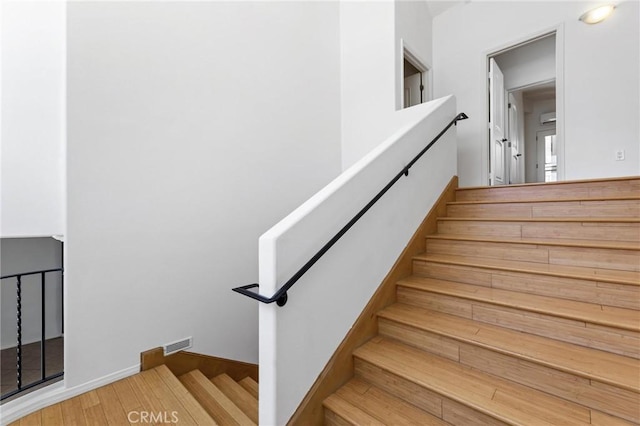 22870 Trigger St, Chatsworth, CA 91311 - stairs featuring wood finished floors and baseboards