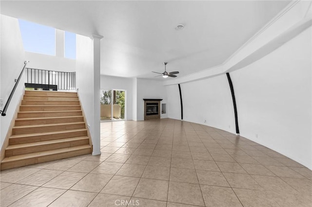 22870 Trigger St, Chatsworth, CA 91311 - unfurnished living room with a ceiling fan, light tile patterned flooring, stairs, and a fireplace